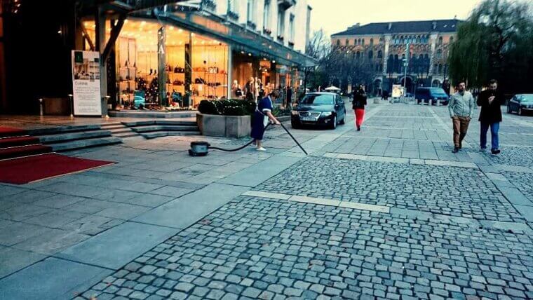 Vacuuming the Hotel Sidewalk