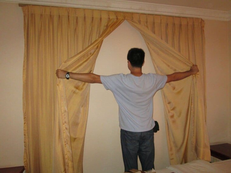The Curtains With a Wall Behind Them