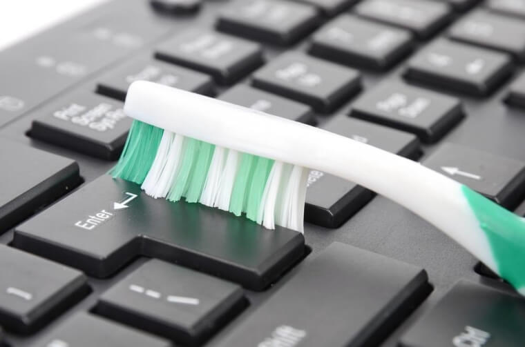 Clean Your Keyboard With An Old Toothbrush
