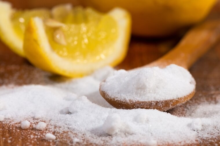 Cleaning A Wood Cutting Board With Kosher Salt And Lemon