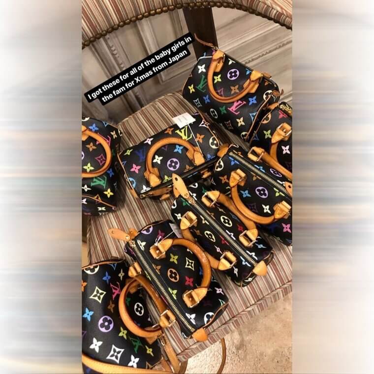 Kim Kardashian Hands Out Mini Louis Vuitton Bags to All the Little Girls